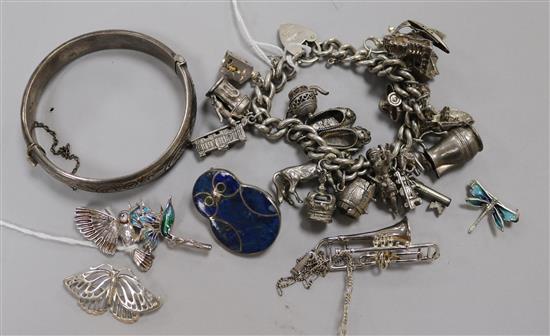 Silver and enamel jewellery, etc, including a charm bracelet with 20 silver and metal charms, an engraved hinged  bangle,